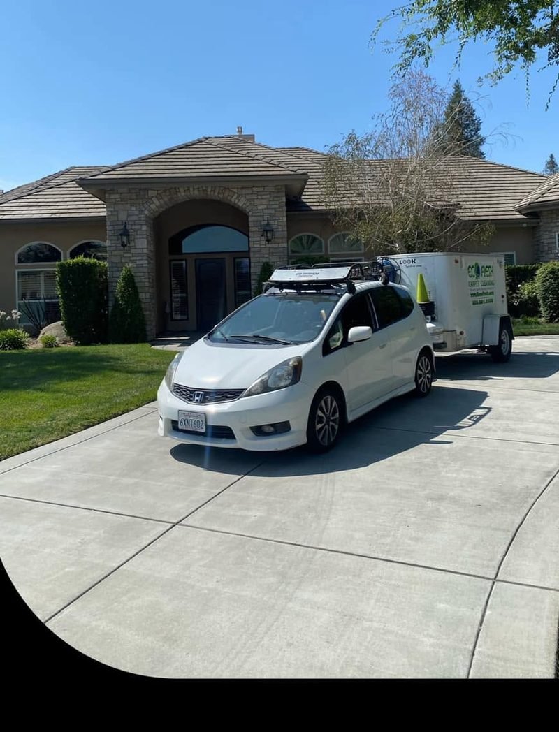 EcoFresh vehicle and trailer in the driveway of a Central Valley home